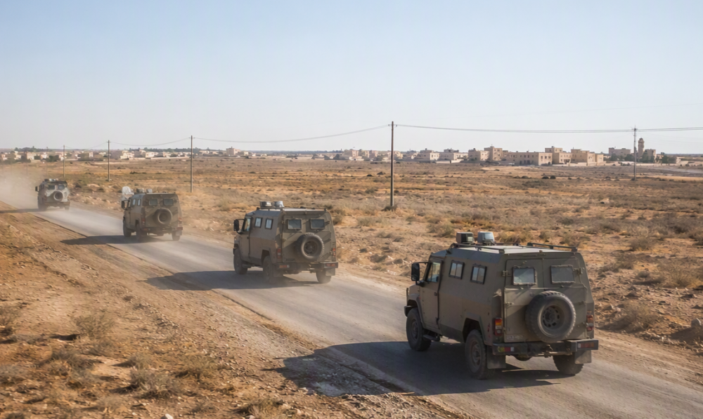 Military convoy on a desert road outside Fallujah, Iraq